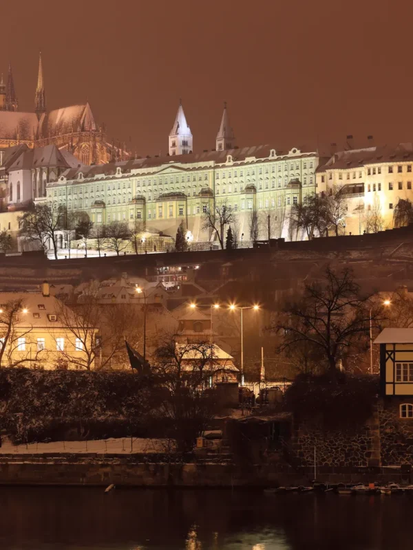 Night view of romantic snowy Gothic Castle in Prague, Czech Republic