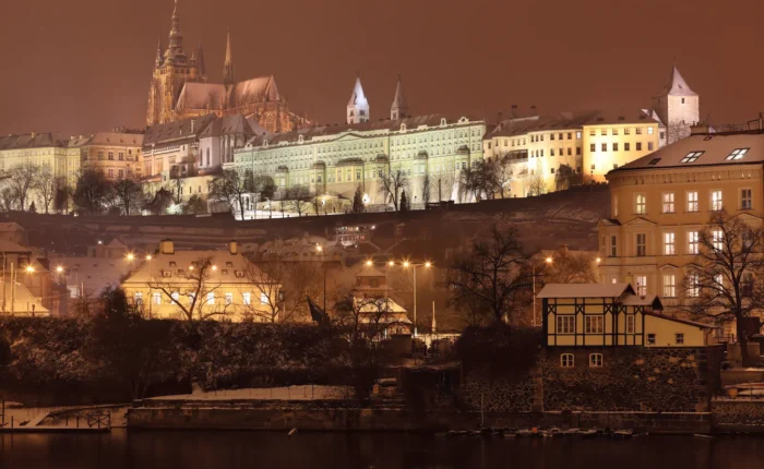 Night view of romantic snowy Gothic Castle in Prague, Czech Republic