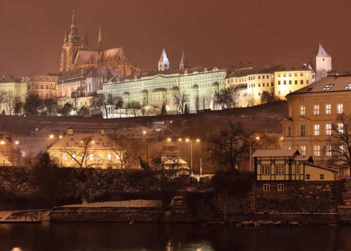 Night view of romantic snowy Gothic Castle in Prague, Czech Republic
