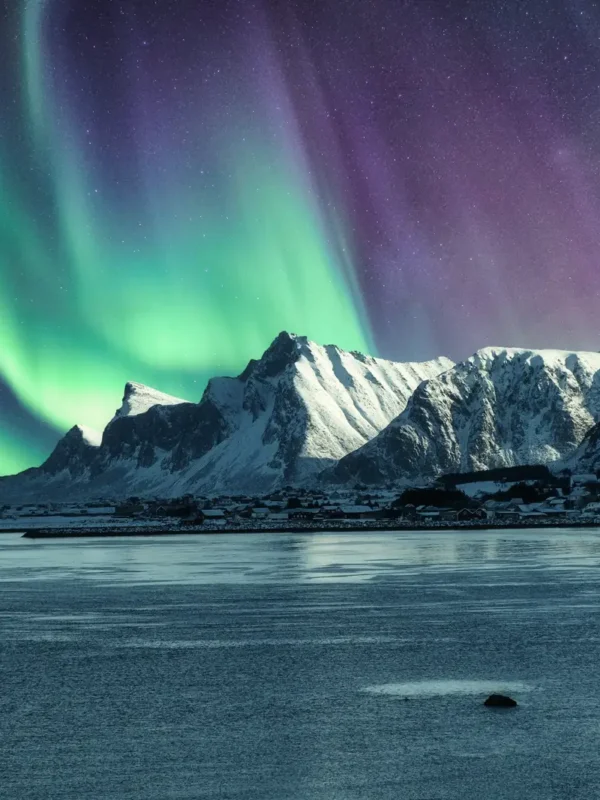 Aurora Borealis, Northern Lights Above of snowy mountain in Lofoten Islands