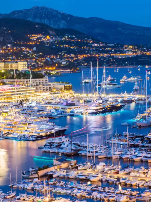 Elevated view of superyachts at Monaco yacht show at dusk