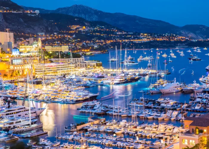 Elevated view of superyachts at Monaco yacht show at dusk