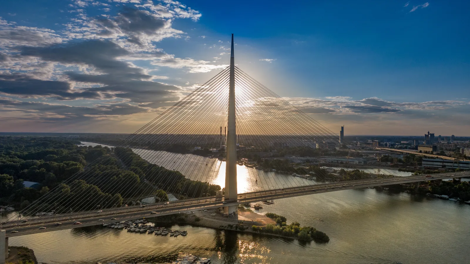 A huge metal bridge across a wide river in Belgrade, Serbia