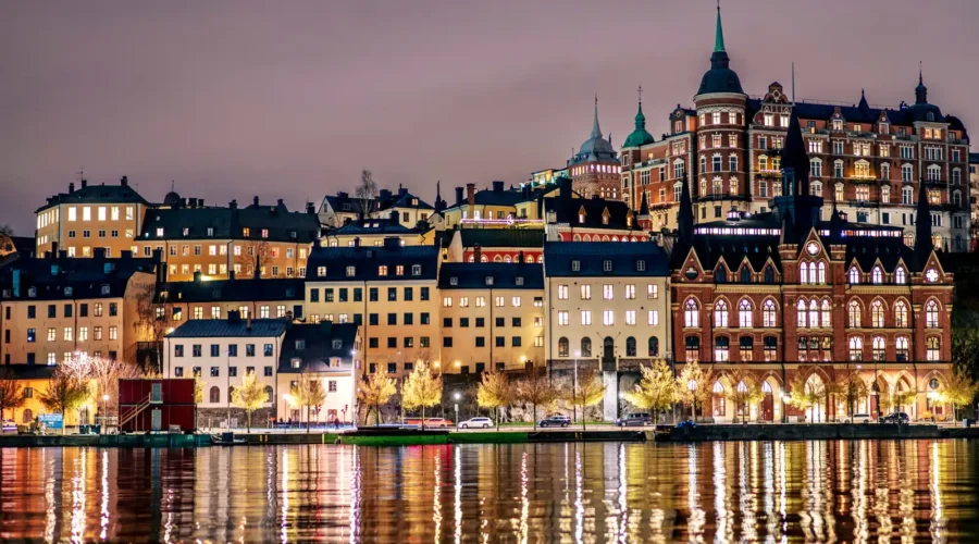 Buildings line the shore of a tranquil body of water, Stockholm, Sweden